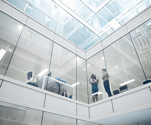 An office building with large glass windows.